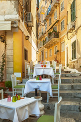 Small restaurant standing on typical narrow street