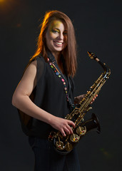 Fototapeta na wymiar woman with saxophone