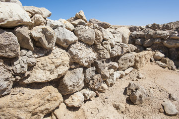 Old roman ruins on desert coastline