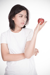 Smiling woman with apple isolated on white