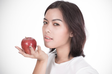 Smiling woman with apple isolated on white