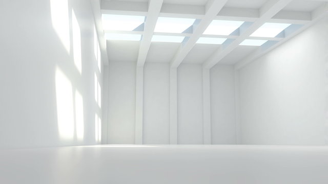 white room with light passing through  and vertical columns at the far wall