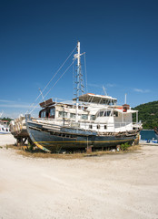 rotting boats in greek boatyard