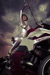 Warrior biker, Sensual and Beautiful brunette woman on a motorcy
