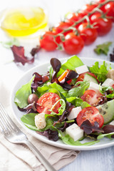 healthy salad with tomatoes olives and feta cheese