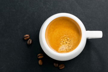 espresso on a black background, top view