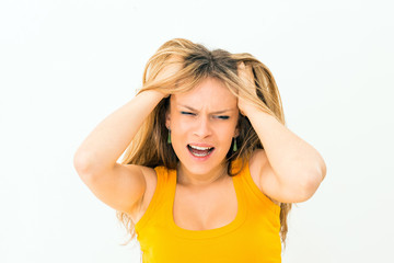 Fototapeta premium crazy woman making a face and pulling hair