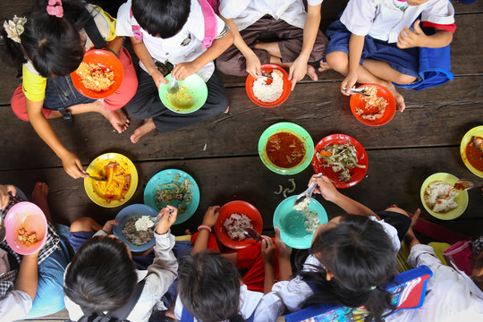 Children having lunch in asian school