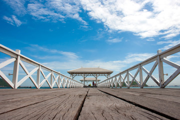 white wooden bridge in waterfront pavilion at the sea