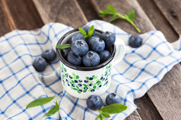 Fresh blueberry in the mug