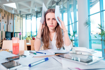 Girl studying hard at the University canteen