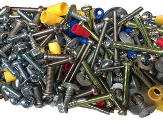 Assortment of nuts and bolts of various sizes and colors