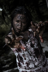 Fototapeta na wymiar Zombie girl in haunted house