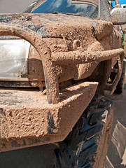 Closeup of a muddy off-road car