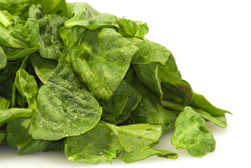 Fresh green leaves spinach on a white background