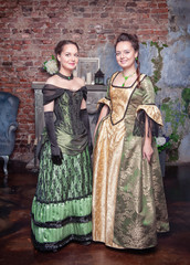 Two beautiful women in medieval dresses