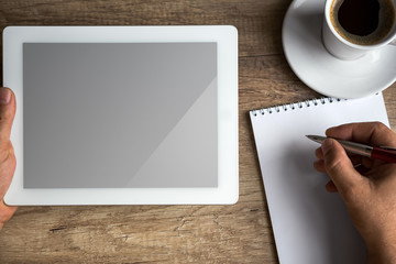 Digital tablet pc on business desk with blank screen