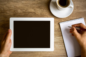 workplace with digital tablet, notebook and coffee cup