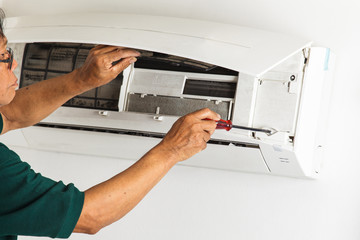 man repair air conditioner