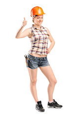 Female construction worker giving thumb up