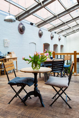 table with two chairs - french-style restaurant