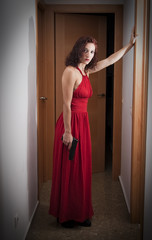 Beautiful  Woman with a red dress and a gun