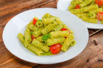 Rigatoni pasta with genoese pesto and sherry tomato
