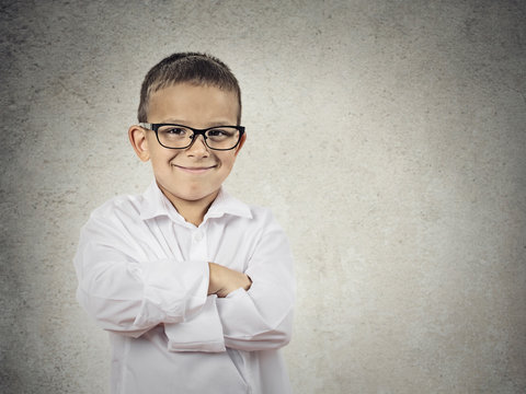 Happy confident little boy, little man isolated grey background 