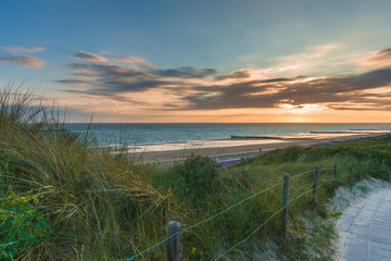 Naklejka na ściany i meble Sunset and Stormclouds at the dutch coast , Netherlands