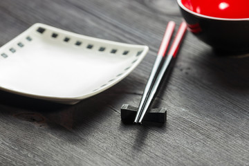 Two chopsticks on sushi mat background