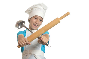 Kitchen boy holding battledore and ladle