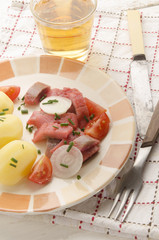 sliced pink ​​herring fillet with potato