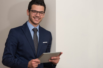 Young Man Working On Computer In Office