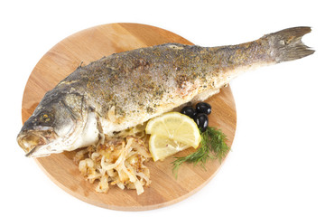 grilled sea bass with lemon, olives, herbs and onions on a woode