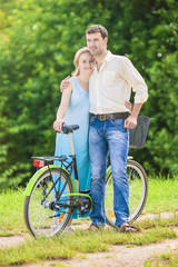 Happy Couple Together with Bicycle. Positive Expression