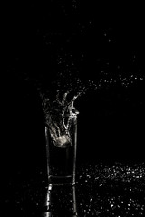 Water splashing out of a glass