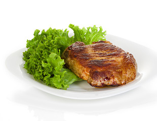 meat steak with lettuce isolated on white background