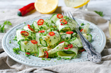 Salad with cucumber, pepper and poppy seeds