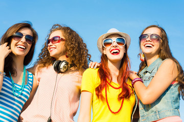 group of young people wearing sunglasses and hat