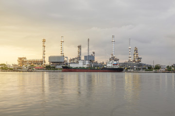 Fototapeta na wymiar Panorama Oil refinery along the river at Dusk (Bangkok, Thailand