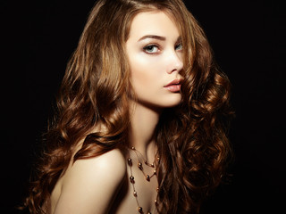 Beauty woman with long curly hair. Beautiful girl with elegant h