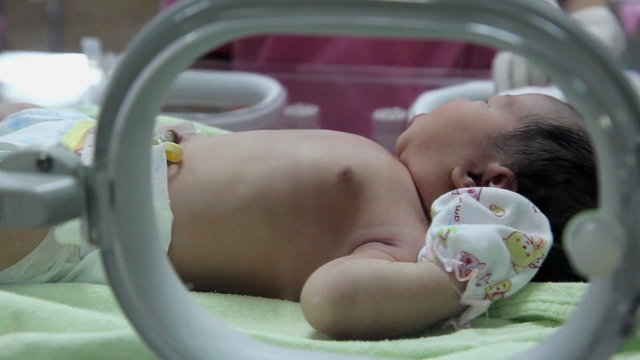 newborn baby in Incubator care at nursery