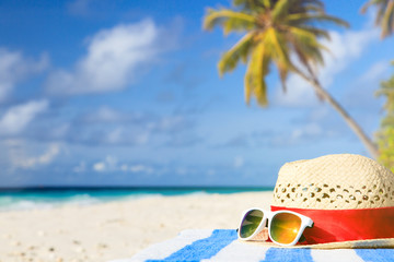 hat and sunglasses on tropical vacation