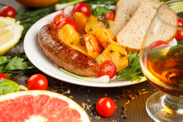 sausage with potatoes and vegetables - obrazy, fototapety, plakaty