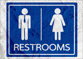Restroom icon and Pictogram Man Woman Sign on Cement wall textur