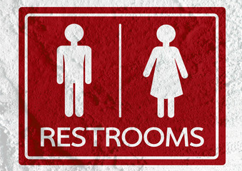 Restroom icon and Pictogram Man Woman Sign on Cement wall textur
