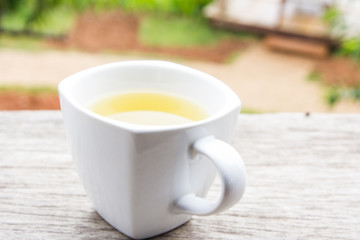 Glass cup of tea  on rustic table