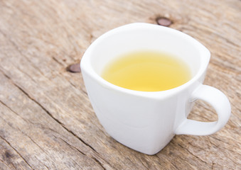 Glass cup of tea  on rustic table