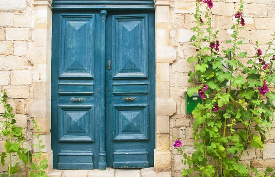 Blue Front Door With Purple Flowers