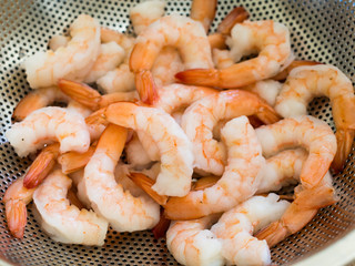 Red prawns in a sieve